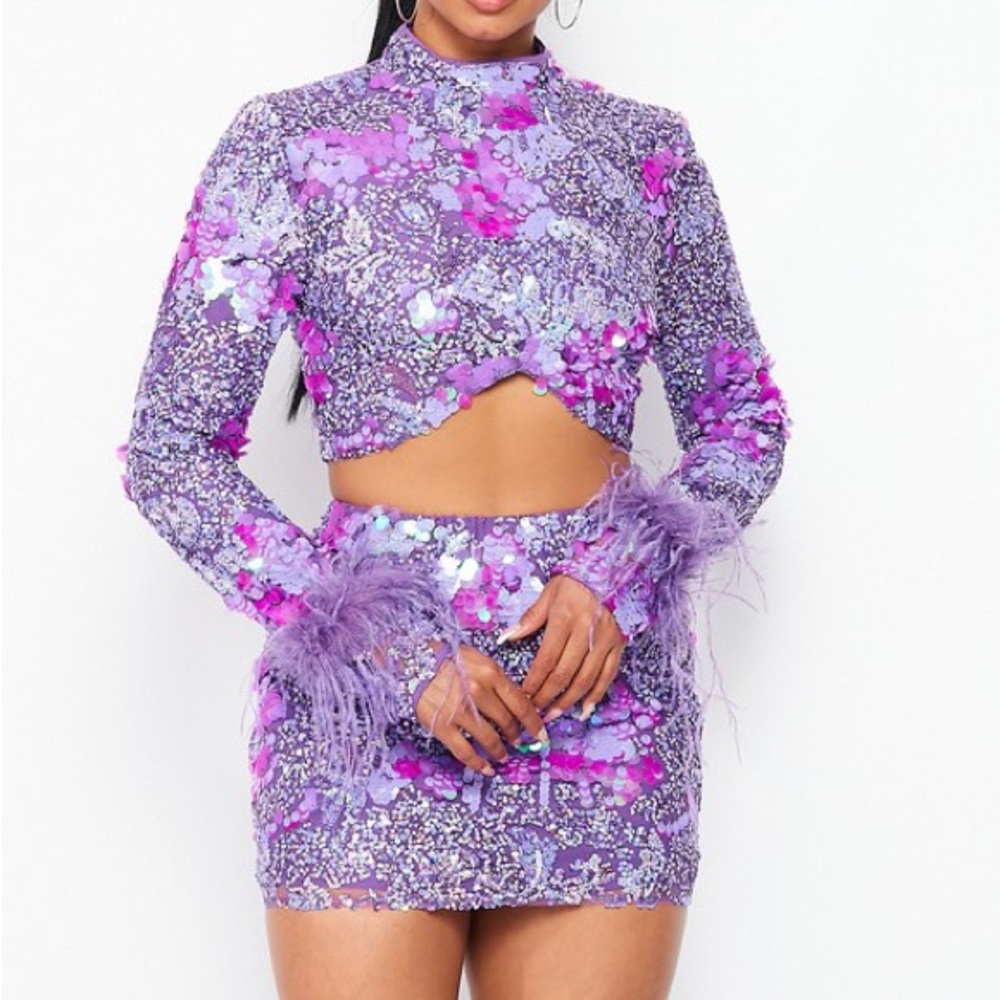 Purple sequin top and skirt set with feathers